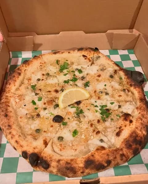 Garlic butter, mozzarella, clams, capers, fresh parsley, lemon wedge.