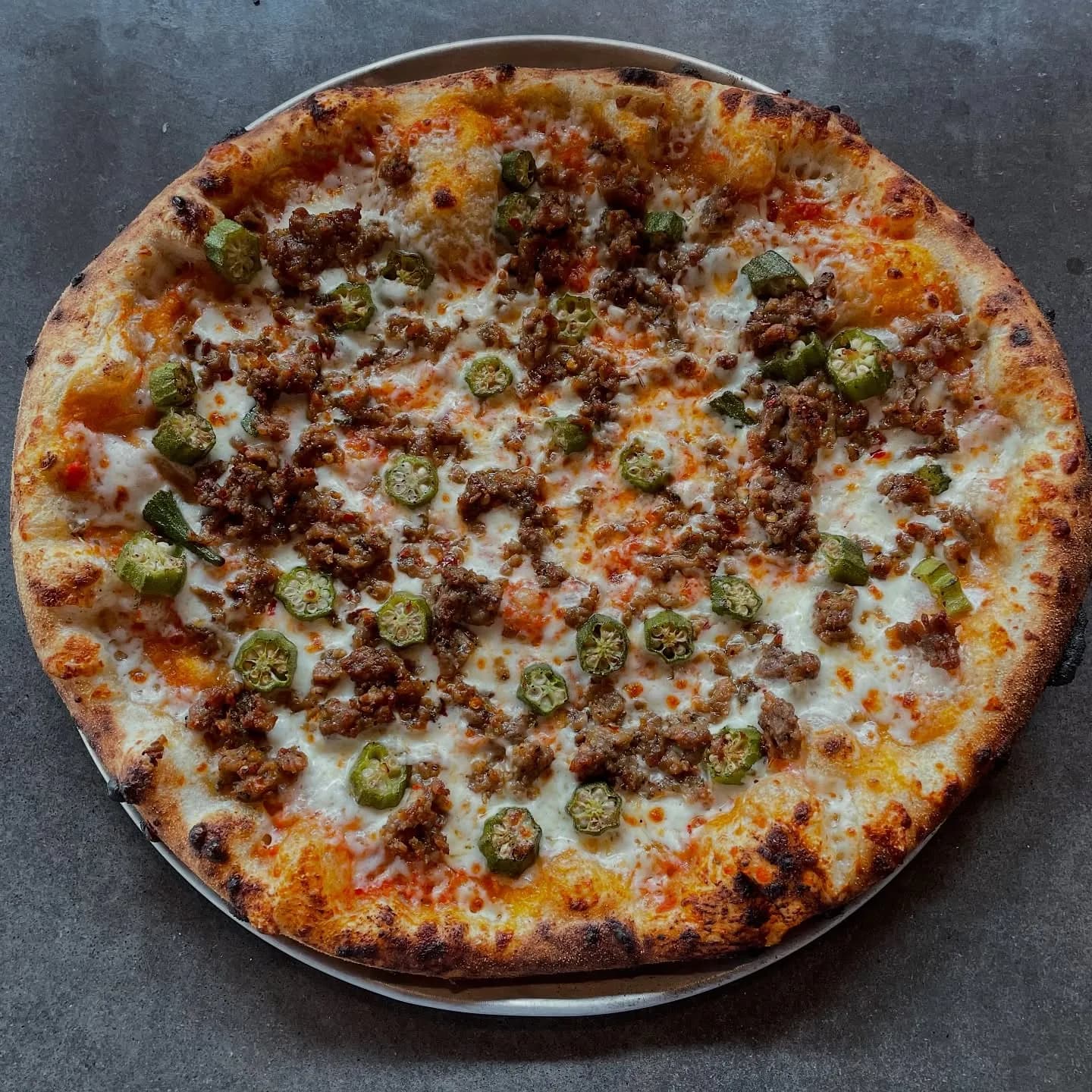 Tomato sauce, mozzarella, roasted okra, spicy sausage.