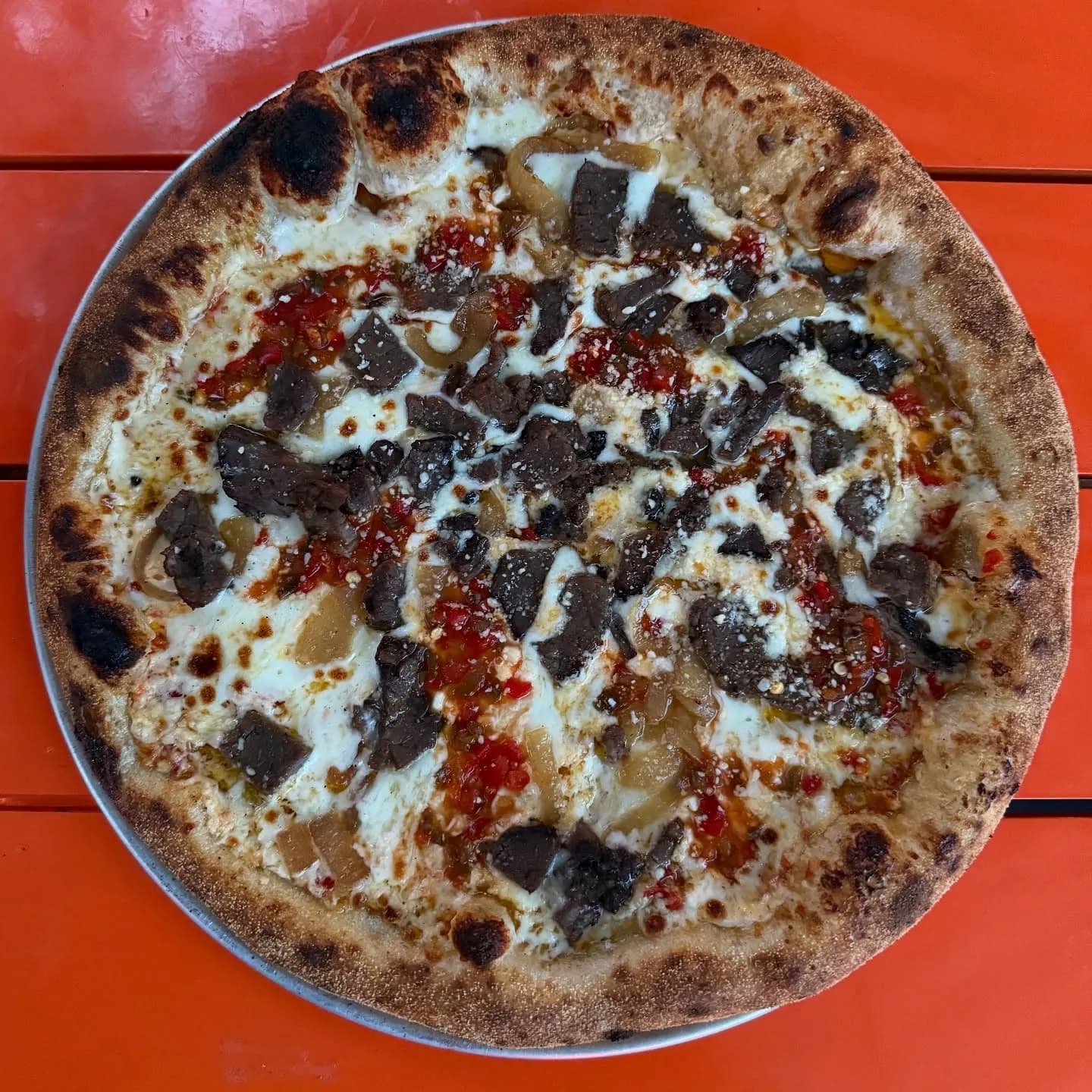 Calabrian-horseradish aioli, mozzarella, caramelized Vidalia onions, roast beef, pepper relish.