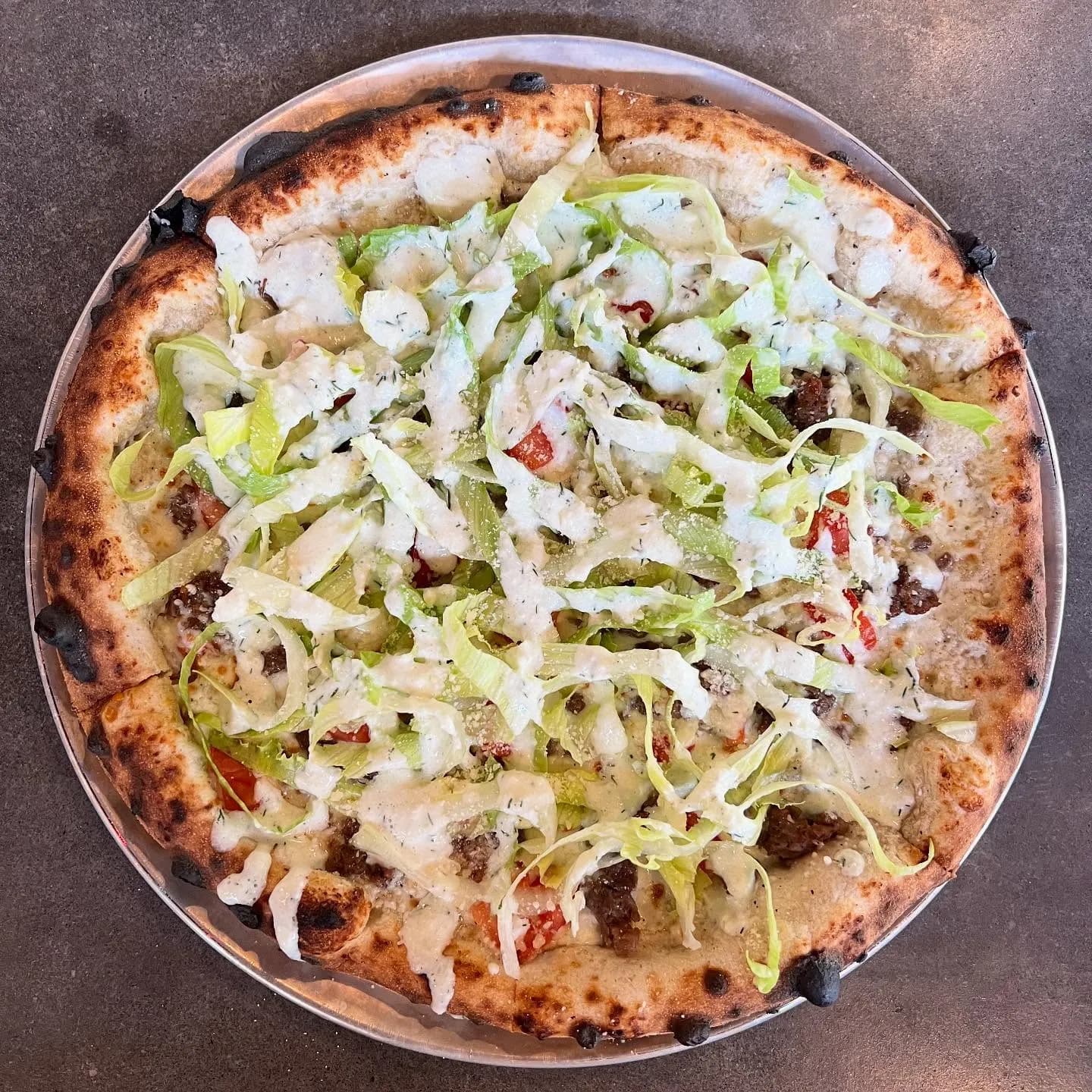 Feta sauce, mozzarella, ground lamb(raised right here in Houston County @silicon_ranch ), tomato, lettuce, tzatziki.