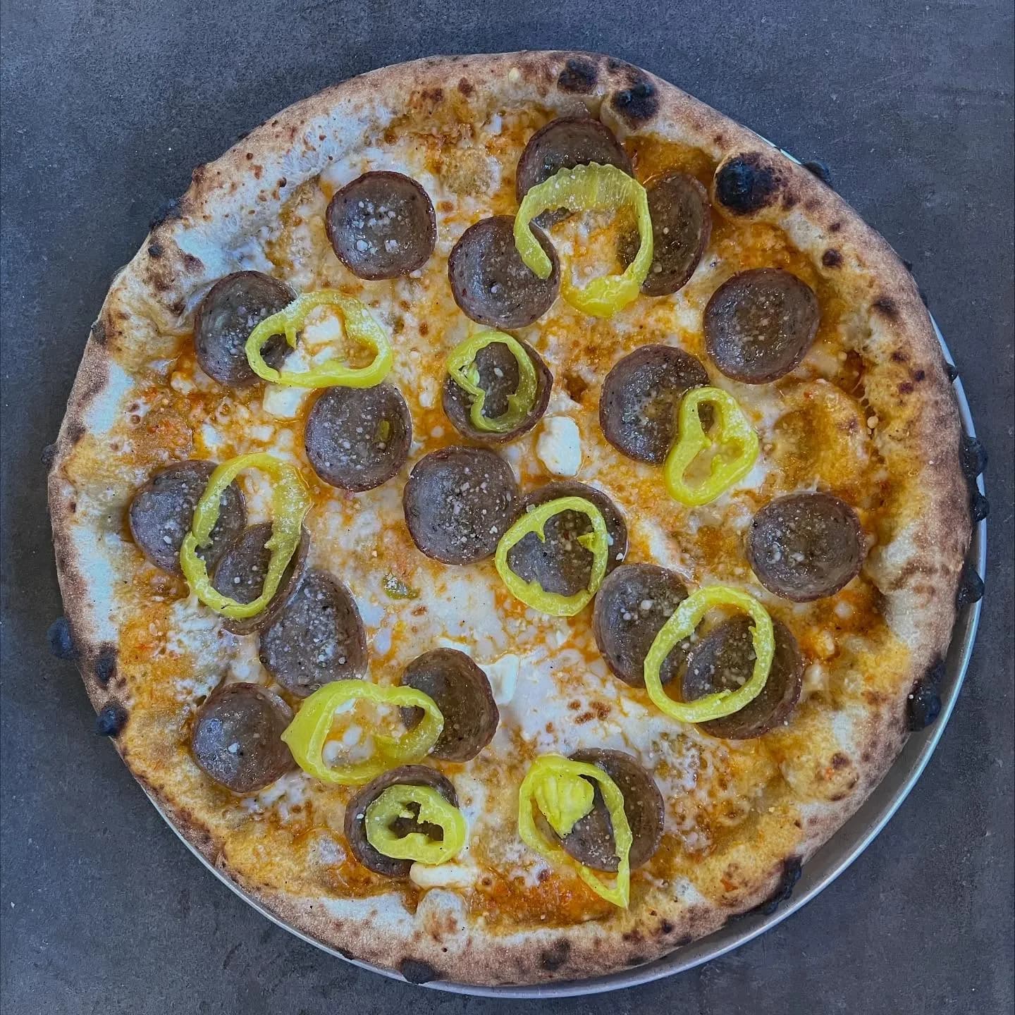 Calabrian chili cream, mozzarella, feta, Italian sausage, banana peppers