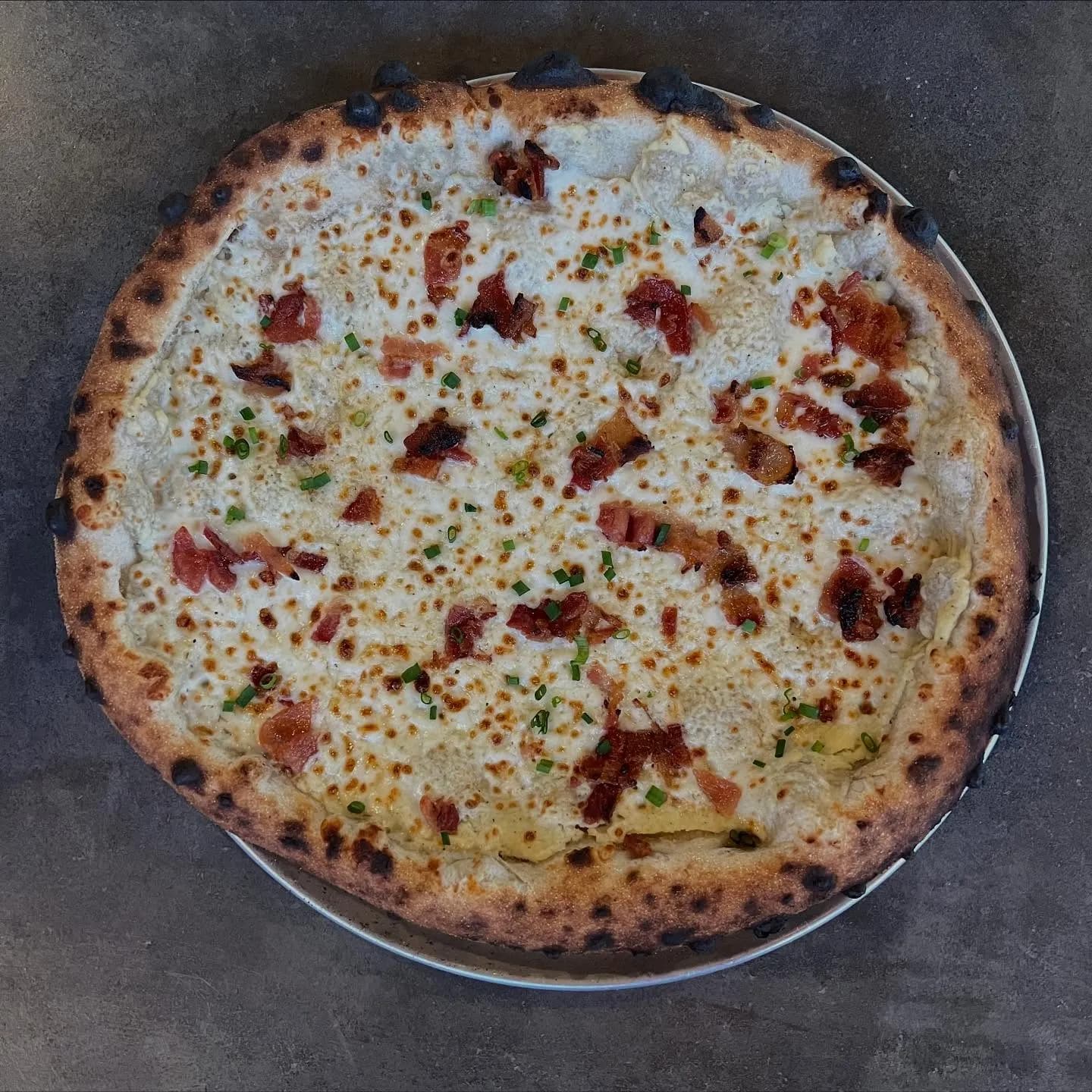 Celery root puree, mozzarella, bacon, chives.