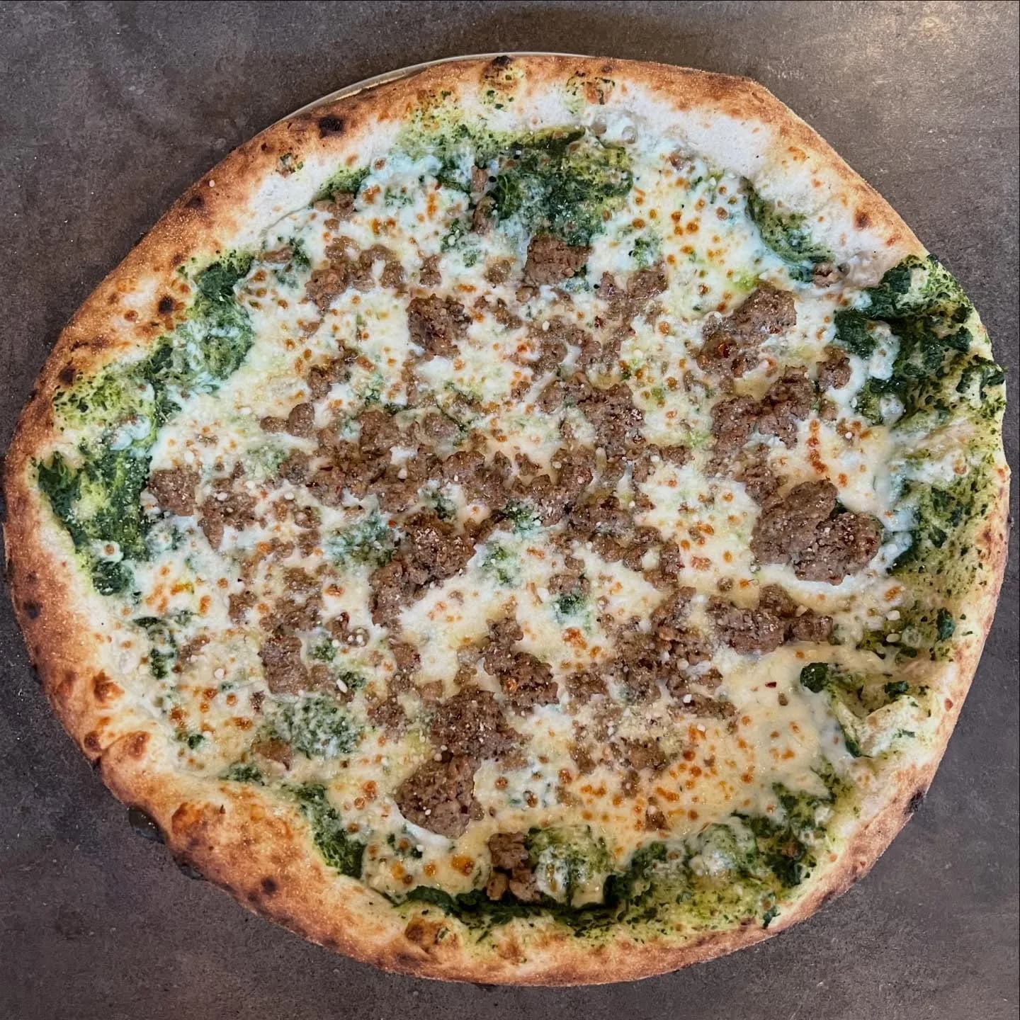 Kale sauce, mozzarella, Sausage.