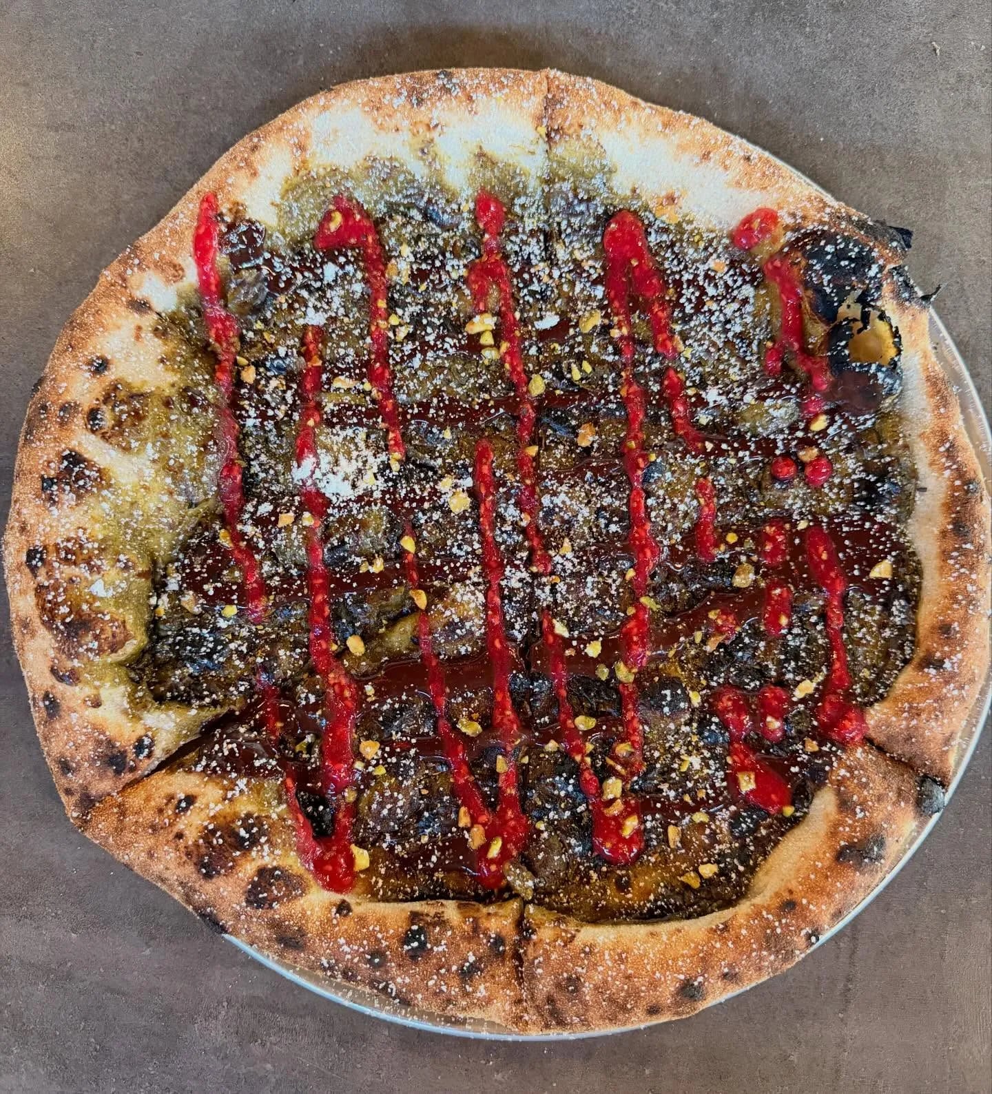 Pistachio paste, chocolate sauce, raspberry puree, powdered sugar, crushed pistachio