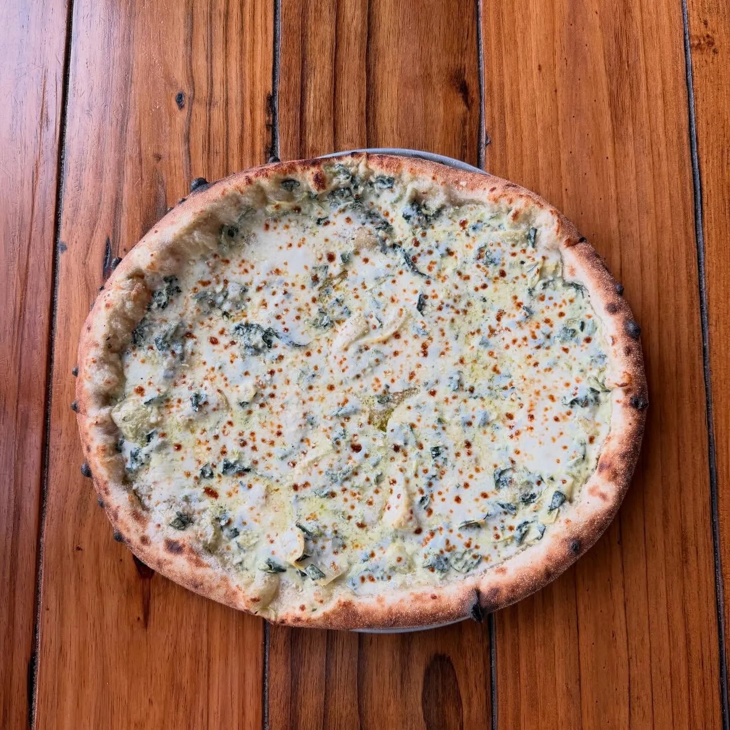 Pesto, artichoke hearts, mozzarella, mortadella, pistachio