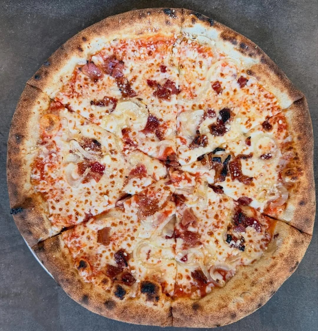 Red sauce, mozzarella, sautéed onion, bacon.